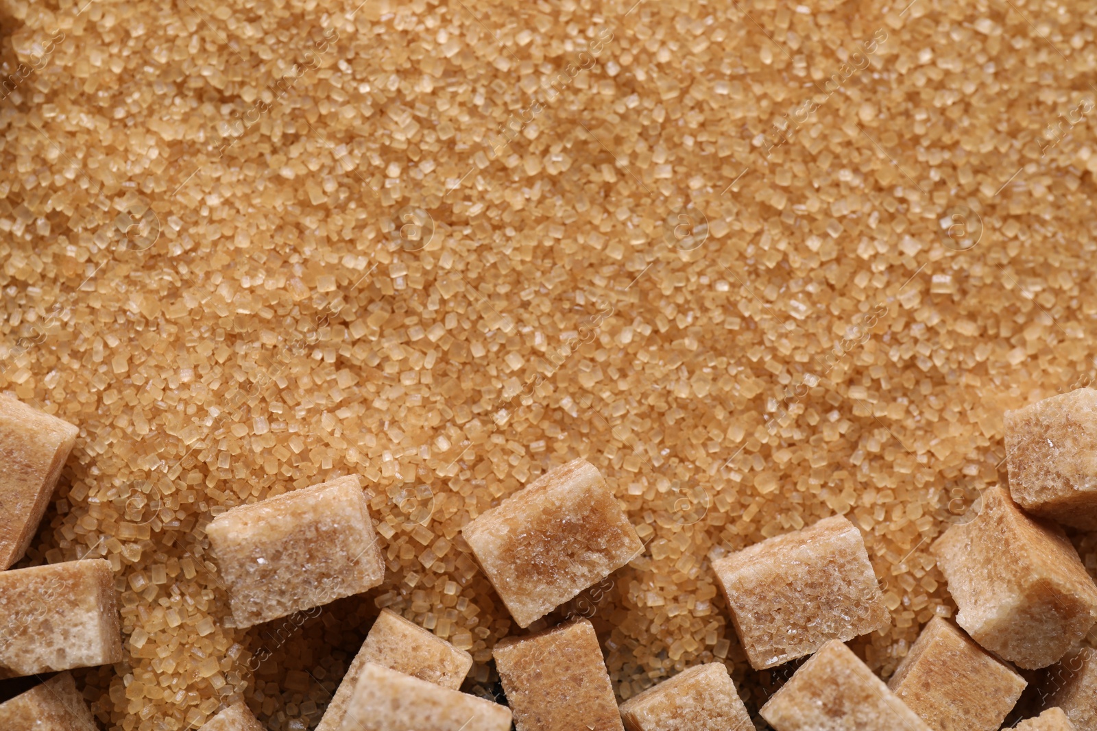 Photo of Different types of brown sugar as background, top view. Space for text