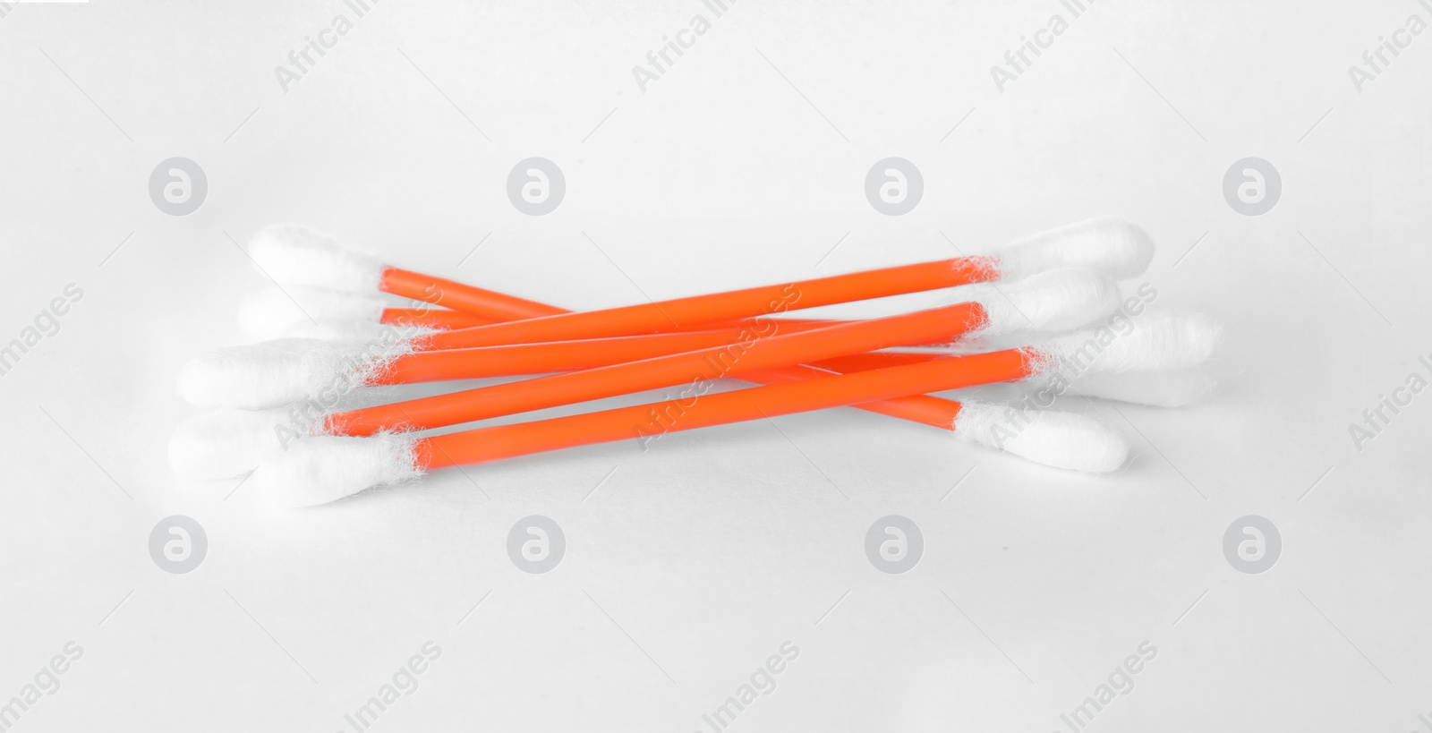 Photo of Heap of clean cotton buds on white background