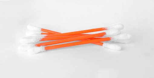 Photo of Heap of clean cotton buds on white background