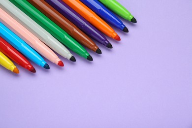 Photo of Different colorful markers on light background, space for text