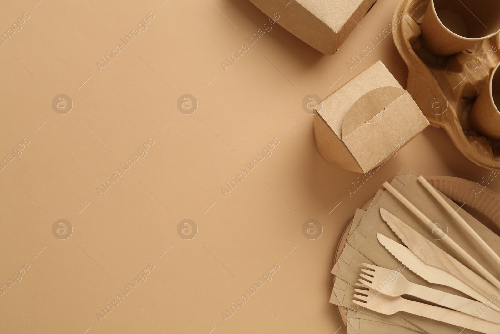 Photo of Flat lay of eco friendly products on beige background, space for text