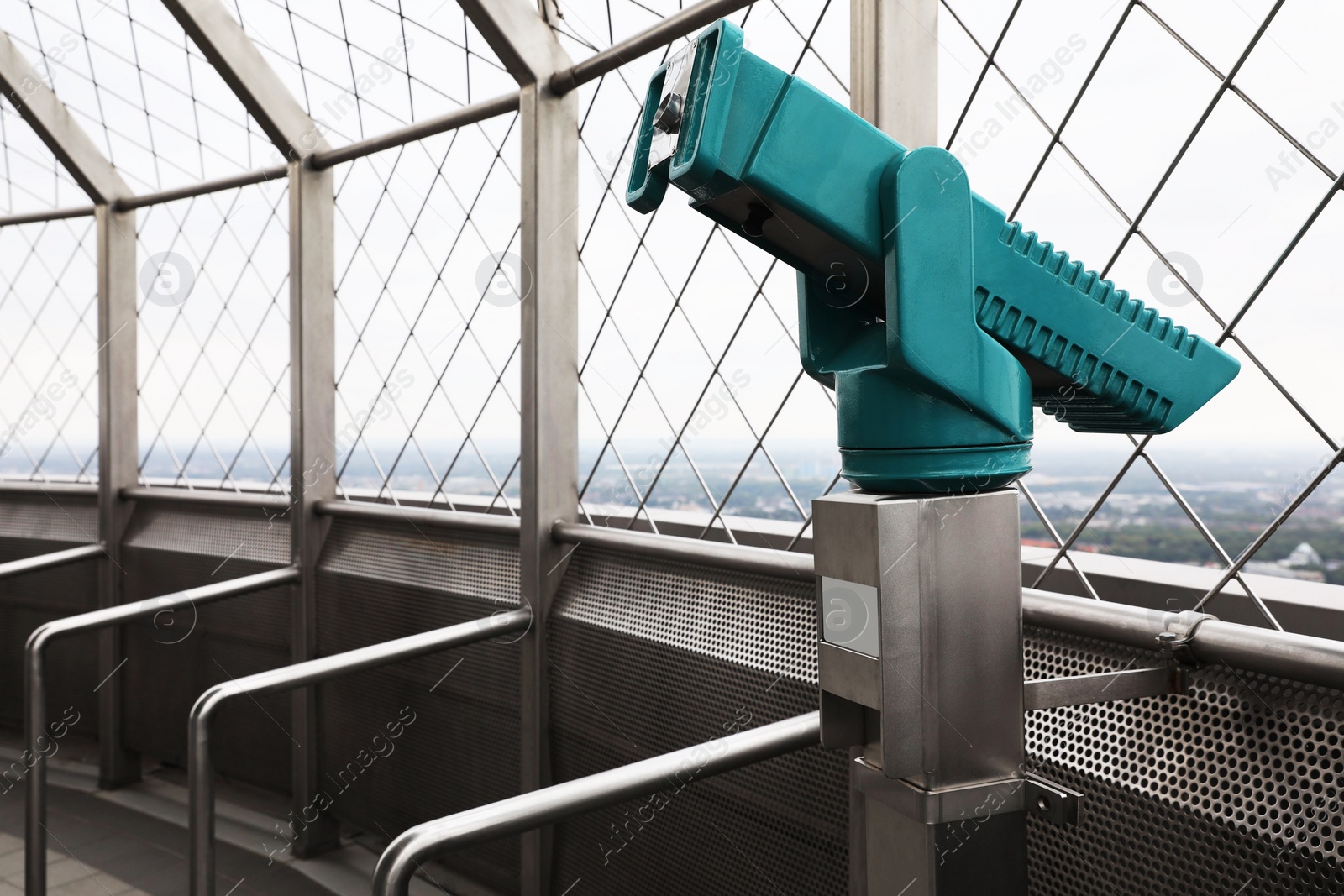 Photo of Green metal tower viewer on observation deck