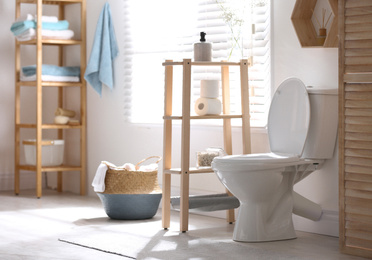 Modern toilet bowl in stylish bathroom interior