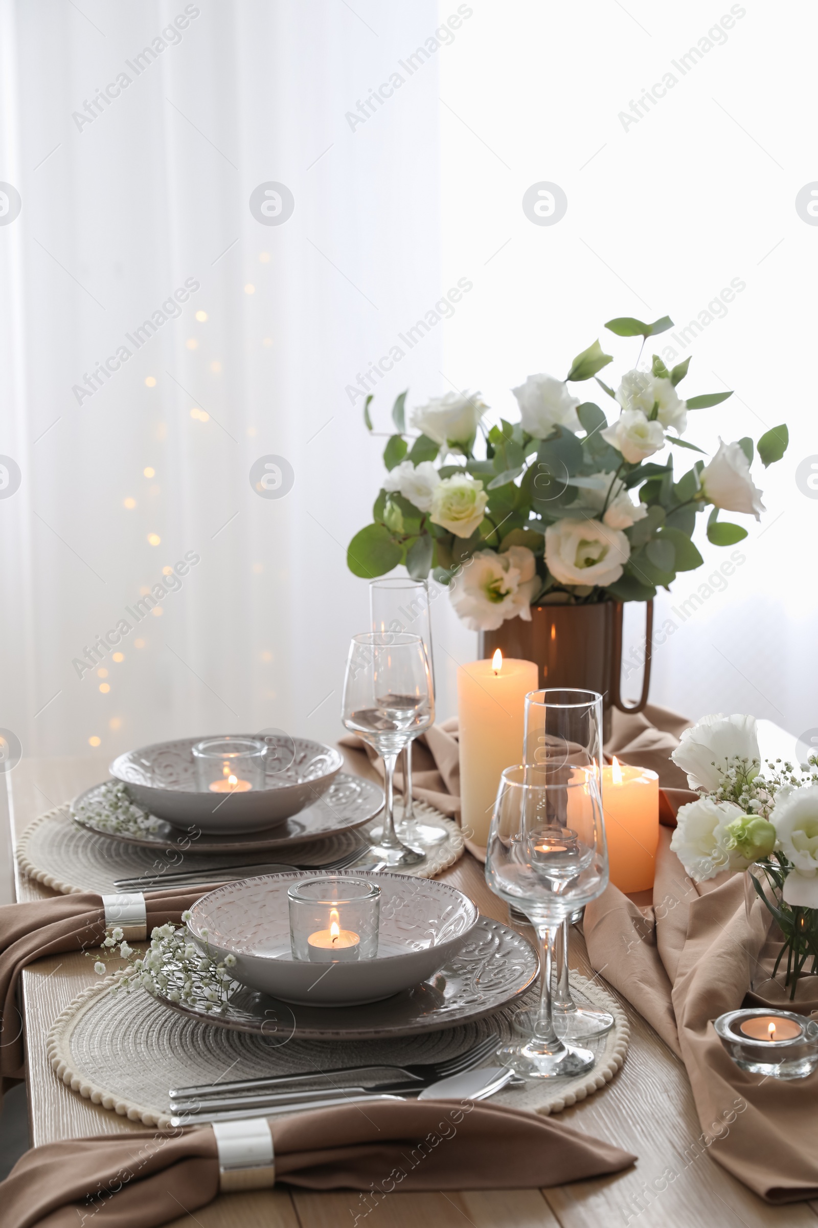 Photo of Festive table setting with beautiful floral decor in restaurant