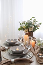 Festive table setting with beautiful floral decor in restaurant