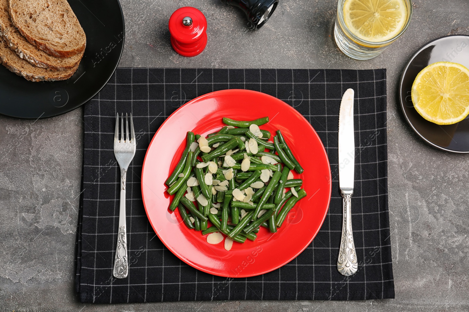 Photo of Tasty green beans with almonds served for dinner on table, top view