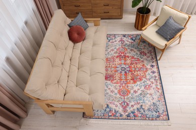 Beautiful rug, sofa, armchair and chest of drawers indoors, above view