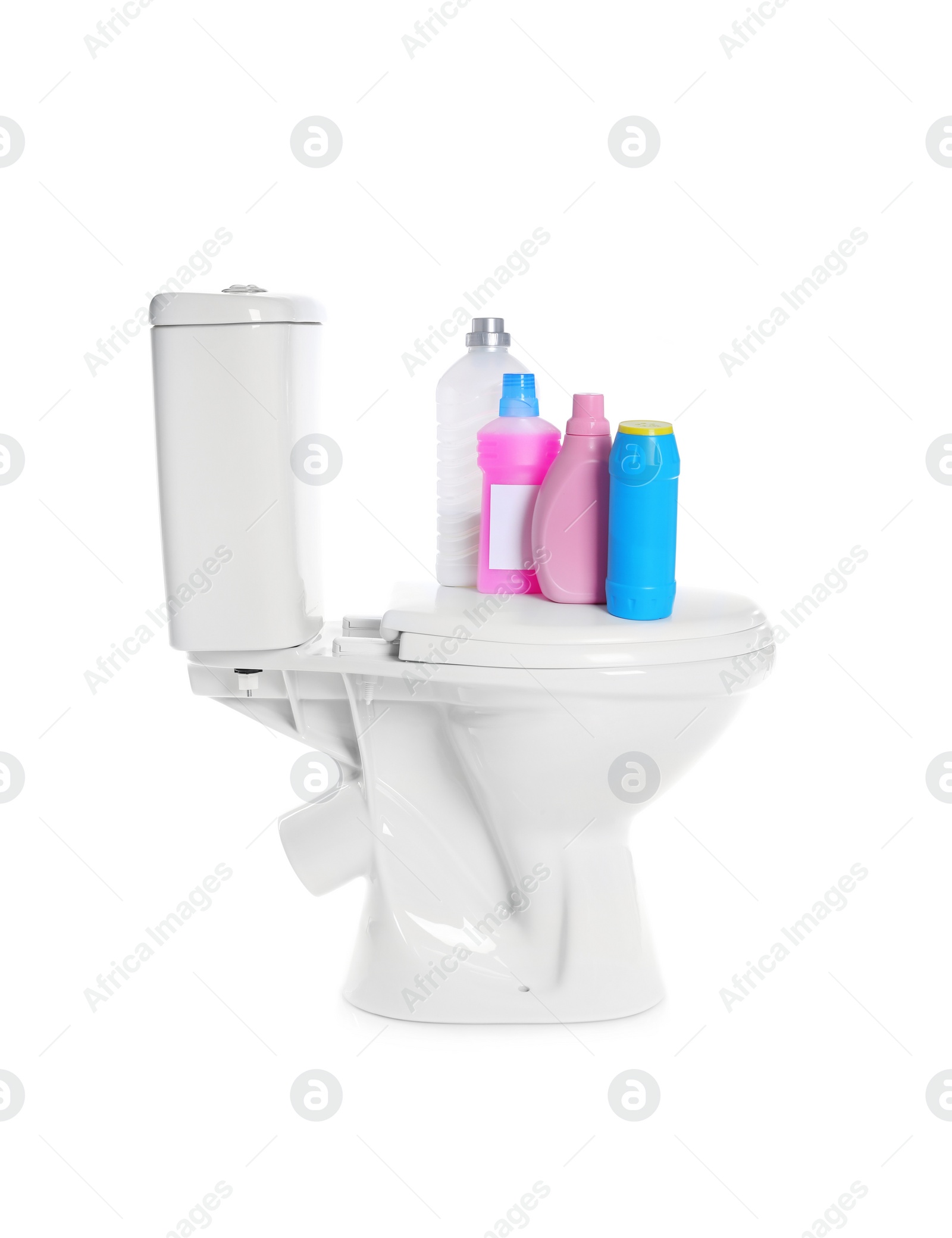 Photo of New ceramic toilet bowl and bottles of detergent on white background