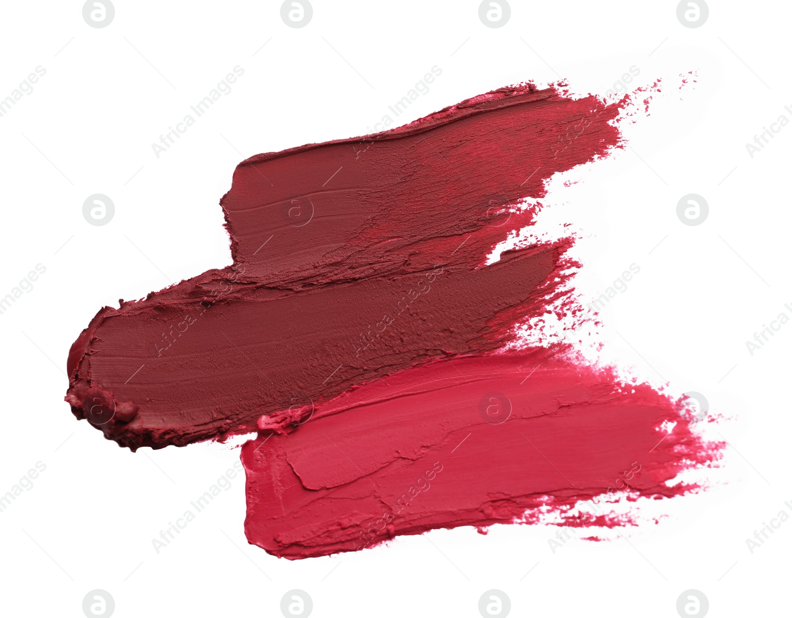 Photo of Smears of bright lipsticks on white background, top view