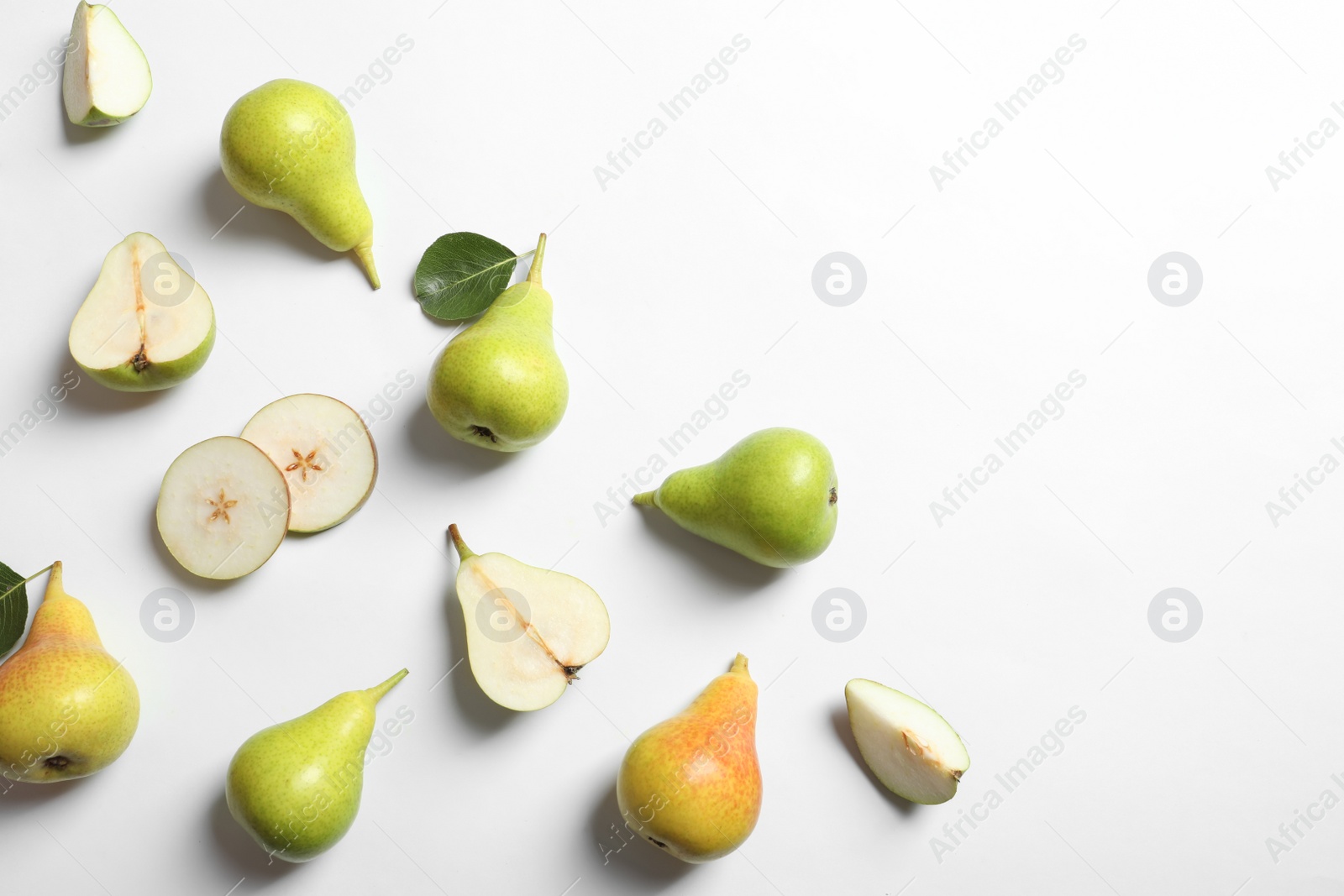 Photo of Ripe juicy pears on white background, top view