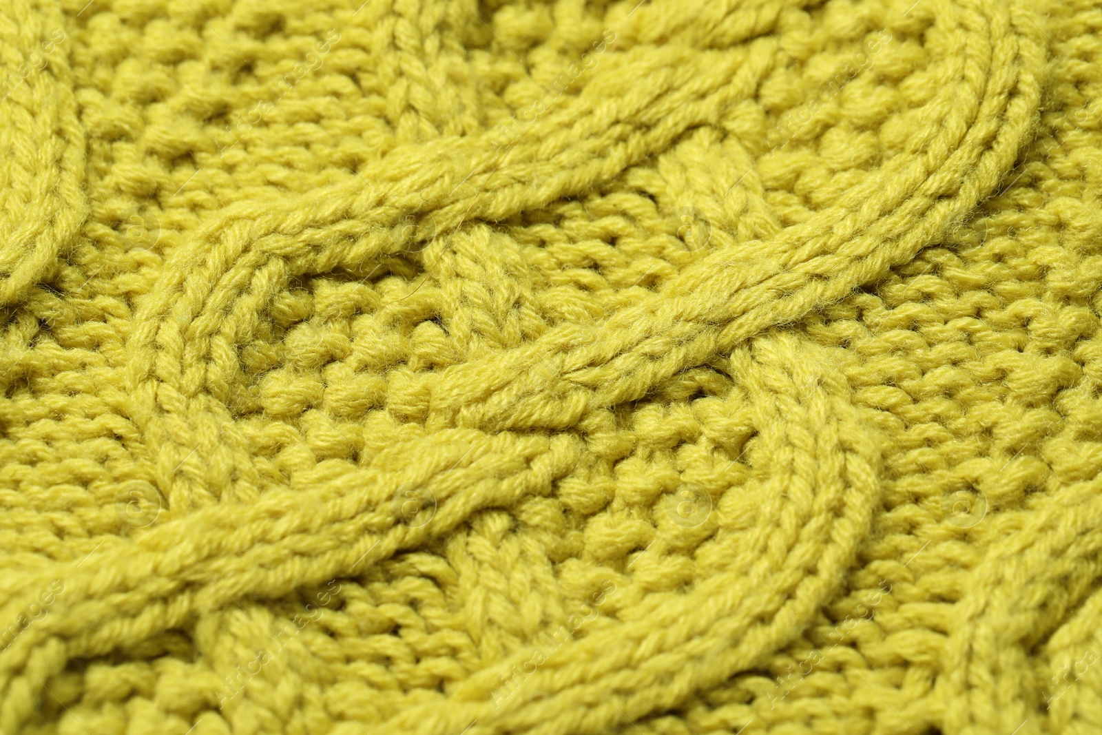 Photo of Texture of soft yellow fabric as background, closeup