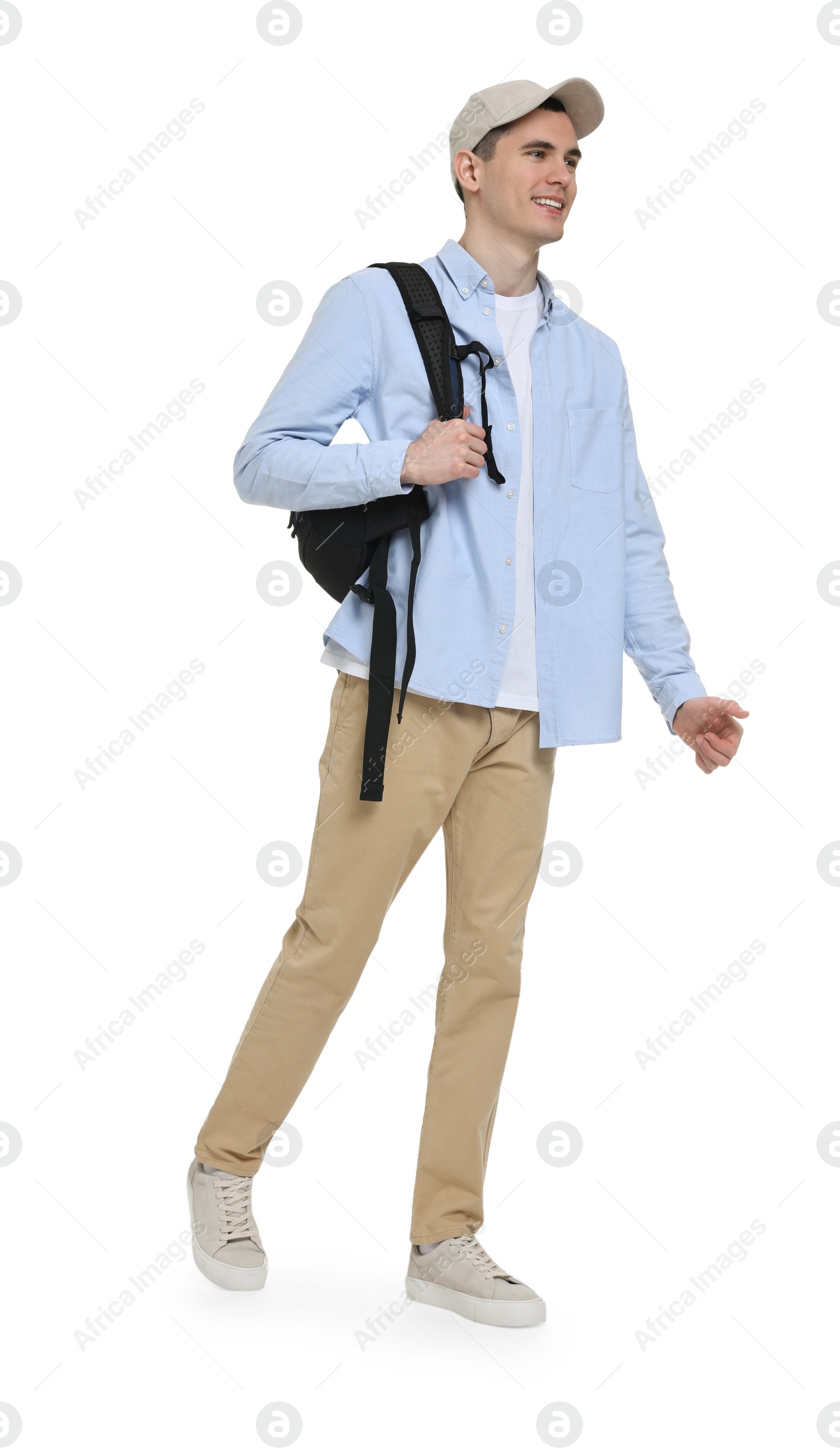 Photo of Young man with cap and backpack on white background