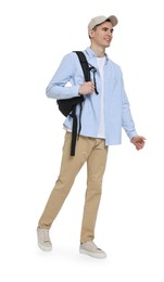 Young man with cap and backpack on white background