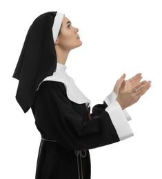 Photo of Nun praying to God on white background