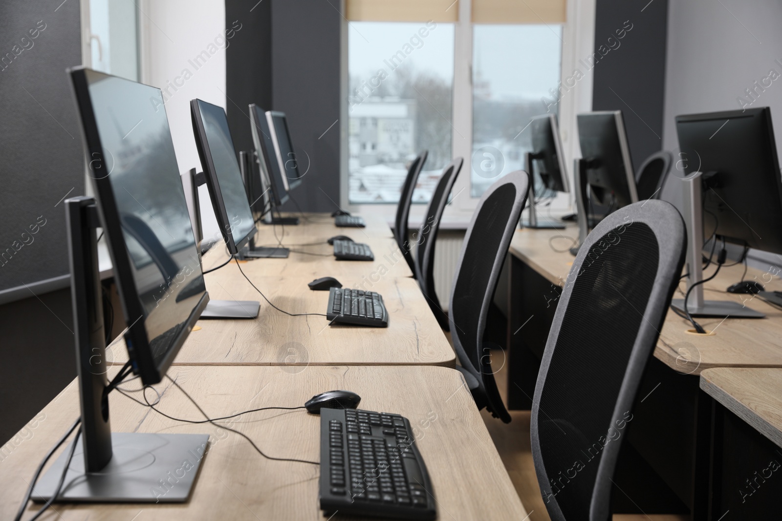 Photo of Many modern computers in open space office