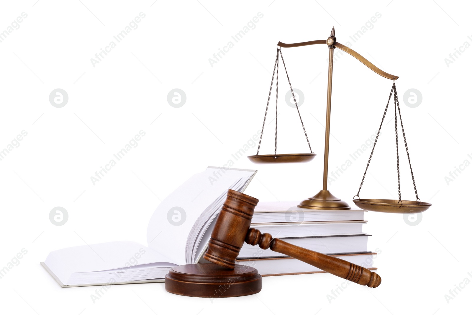 Photo of Wooden gavel, books and scales of justice on white background