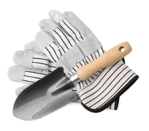Gardening gloves and trowel isolated on white, top view