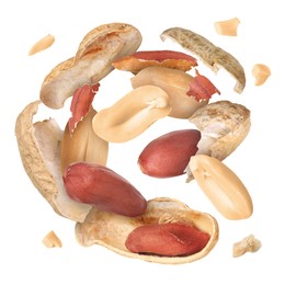 Image of Peanuts and crushed pods in air on white background