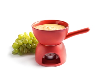 Delicious cheese fondue with grapes on white background