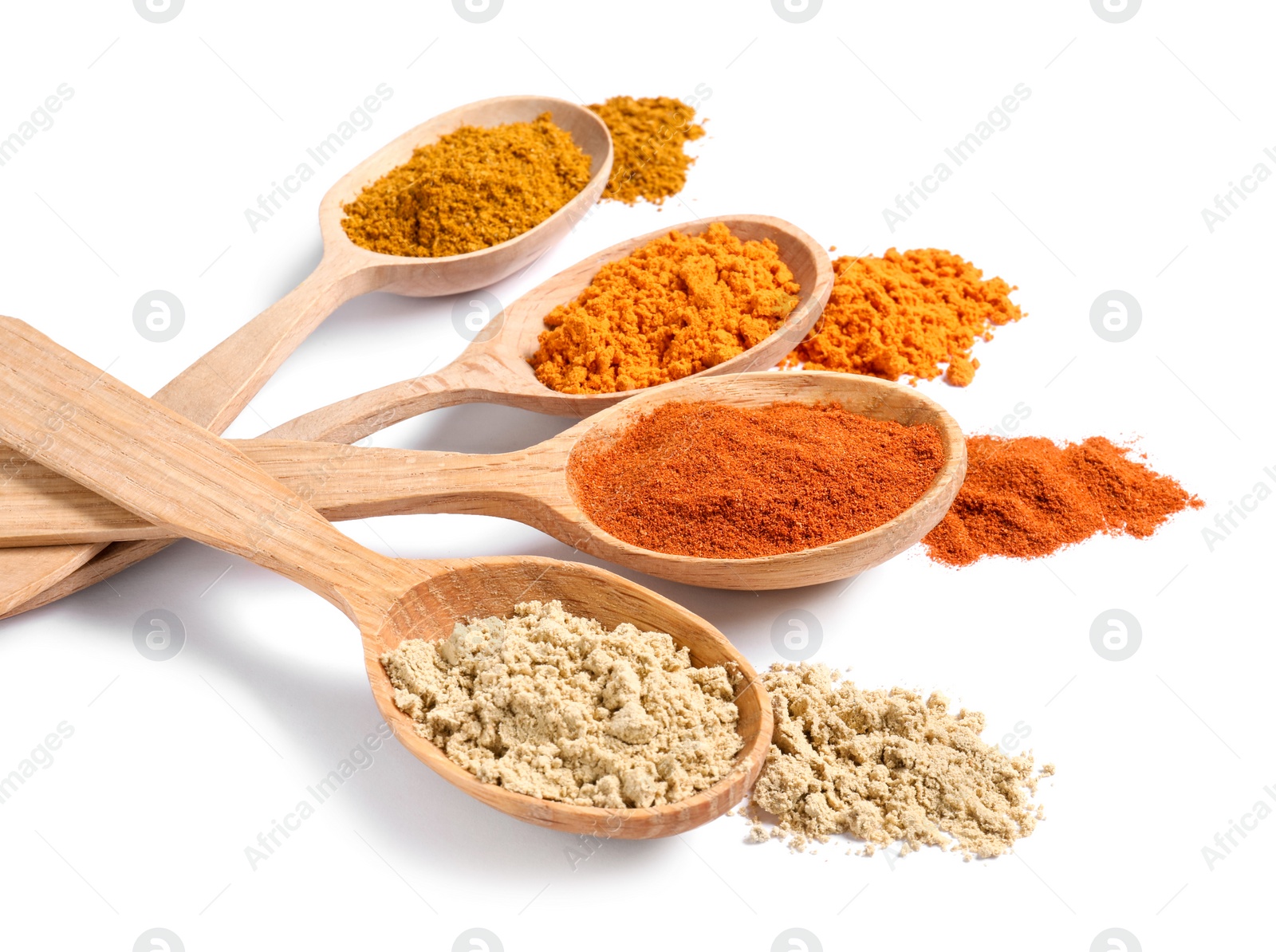 Photo of Wooden spoons with different spices on white background