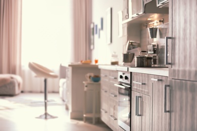 Photo of Modern kitchen interior in light apartment