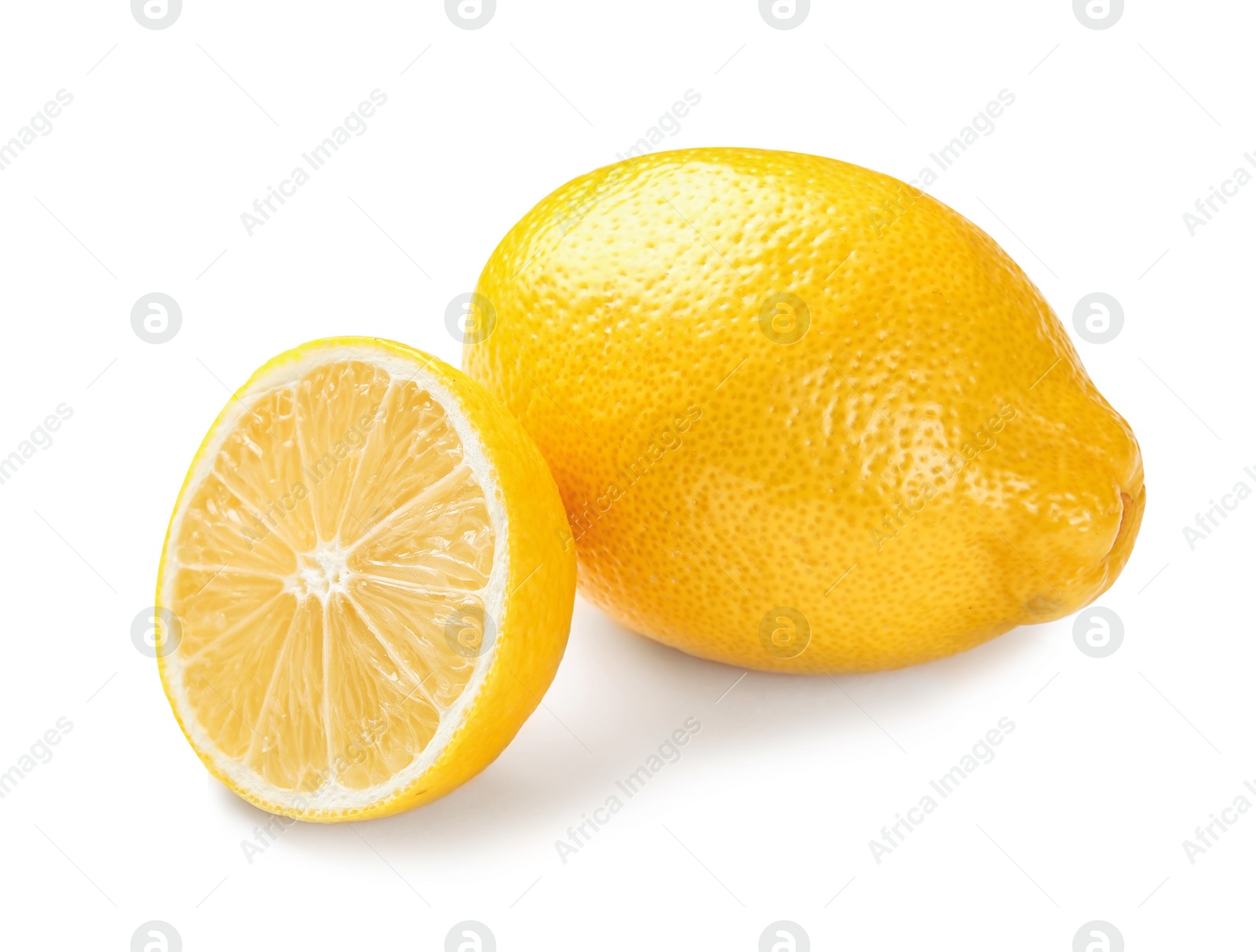 Photo of Ripe whole and sliced lemons on white background