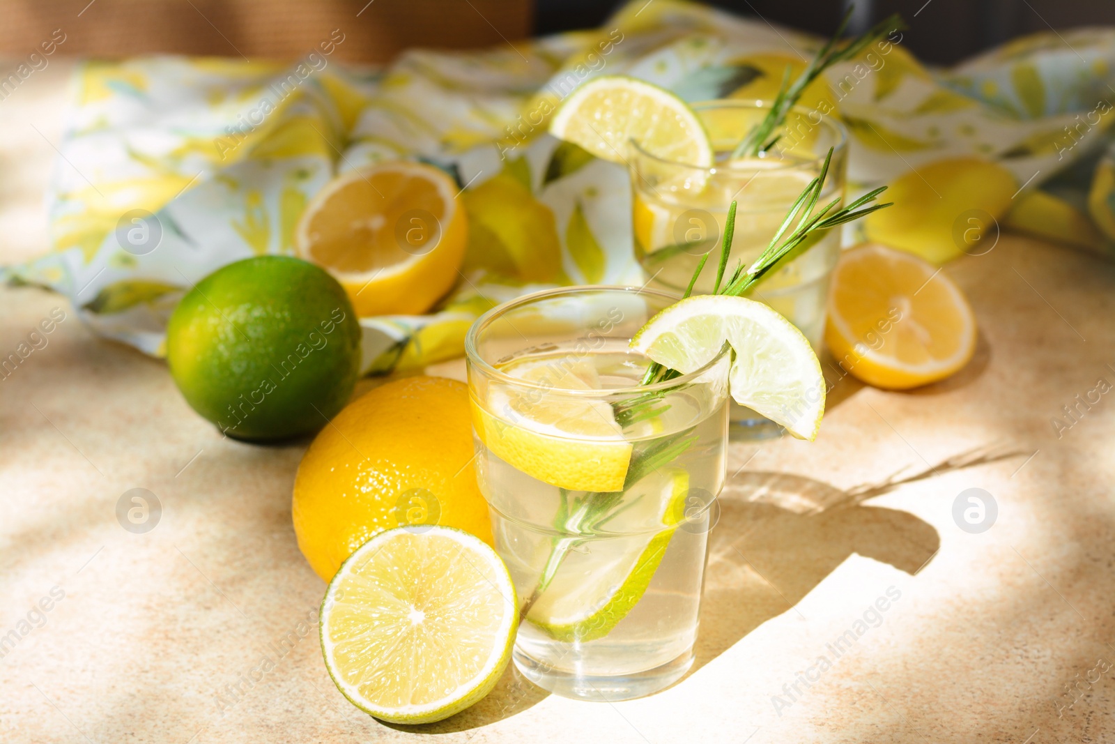 Photo of Summer refreshing lemonade and ingredients on light table