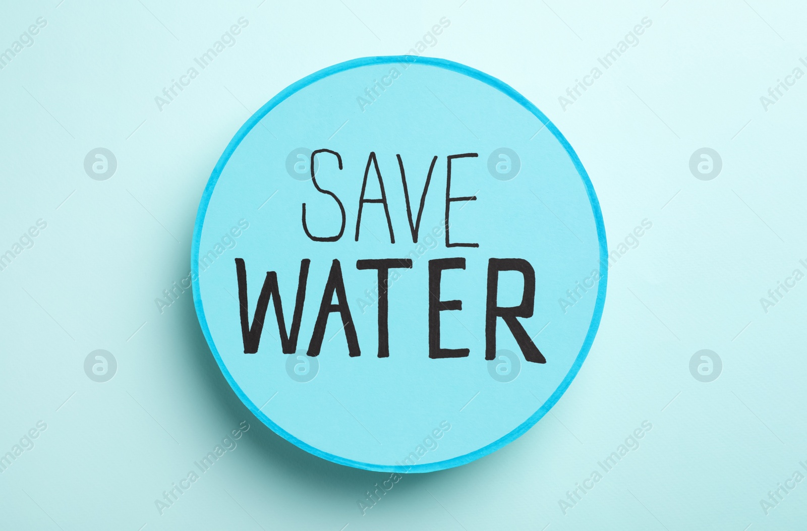 Photo of Card with words Save Water on light blue background, top view