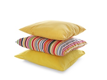 Stack of different colorful pillows on white background