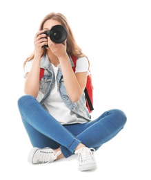 Photo of Female photographer with camera on white background