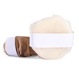 Photo of Solid shampoo bars wrapped in parchment on white background