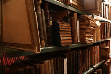 Photo of Collection of old books on shelves in library