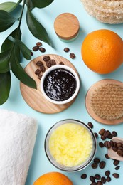 Photo of Flat lay composition with natural body scrubs and fresh ingredients on light blue background. Anti cellulite treatment