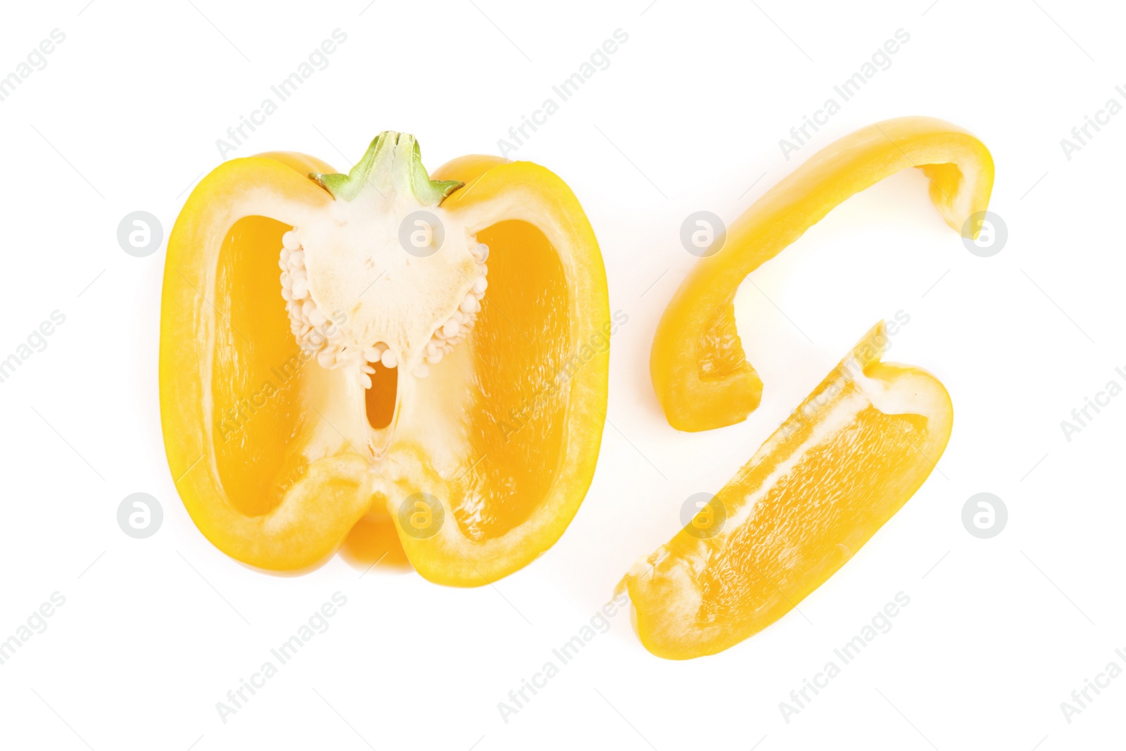 Photo of Cut yellow bell pepper isolated on white, top view