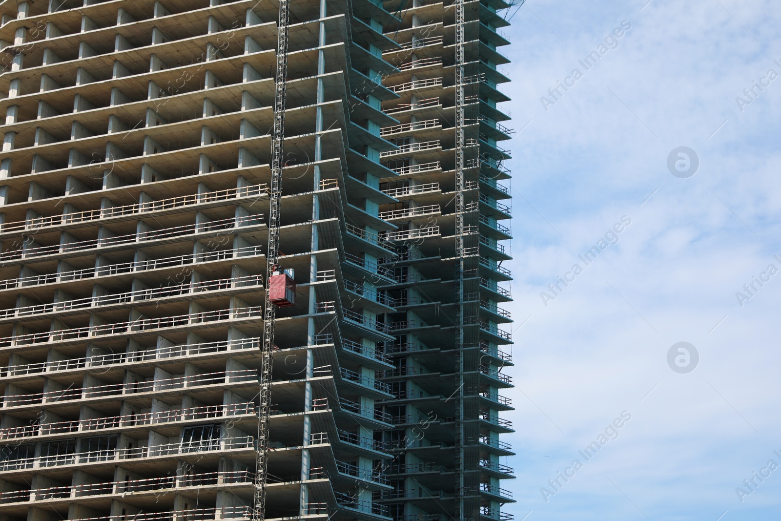 Photo of Construction site with unfinished building on sunny day