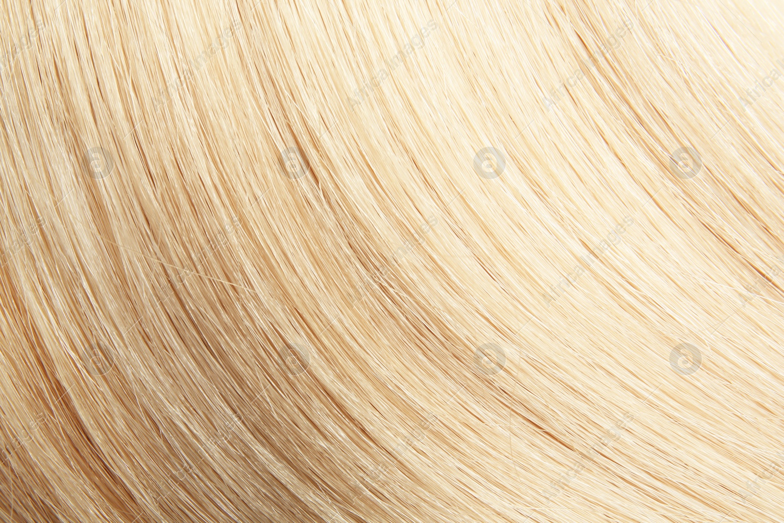 Photo of Texture of healthy blond hair as background, closeup