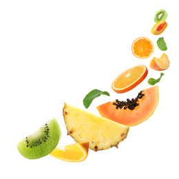 Image of Set of different cut fresh fruits and berries falling on white background