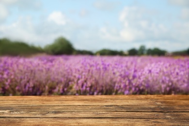 Empty wooden table in fresh lavender field