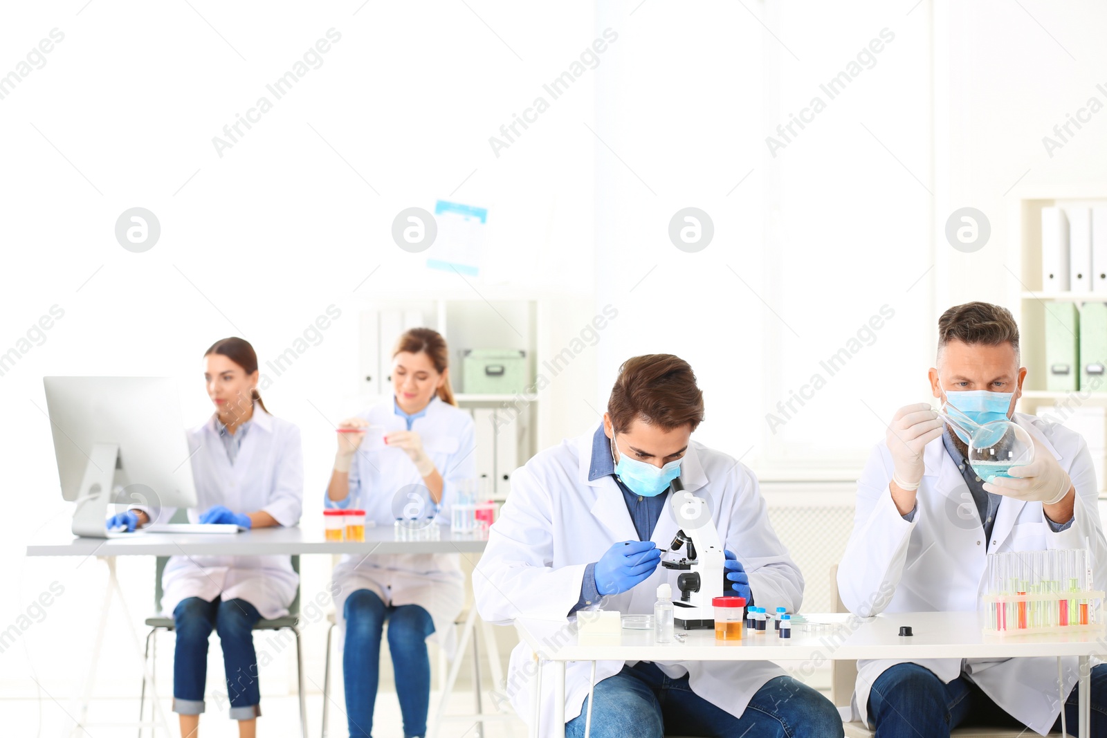 Photo of Scientists working in laboratory. Research and analysis