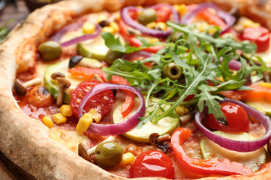 Photo of Delicious fresh vegetable pizza on table, closeup