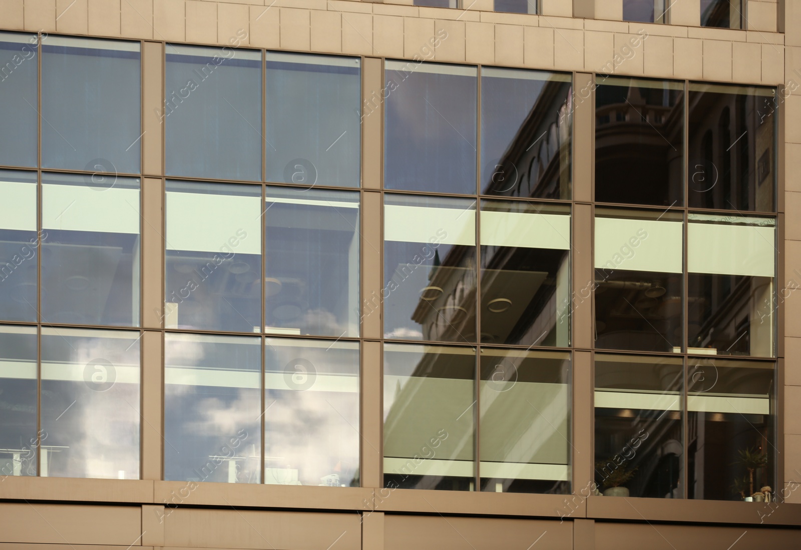 Photo of Modern office building with large windows. Urban architecture