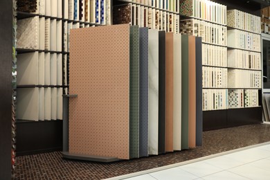 Photo of Many different samples of tiles on display in store