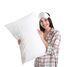 Young woman with pillow and sleep mask on white background