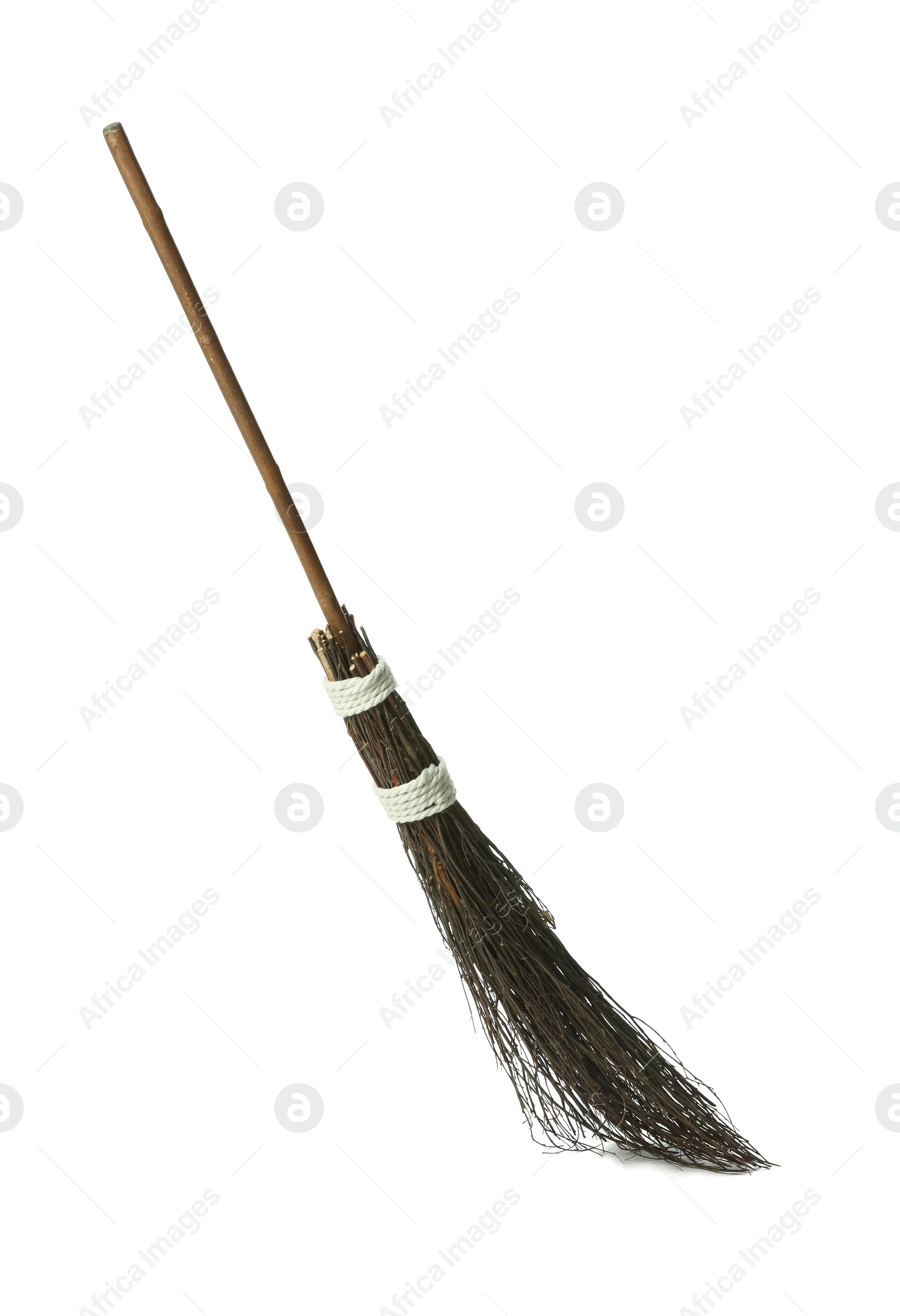 Photo of Old broom with wooden handle isolated on white
