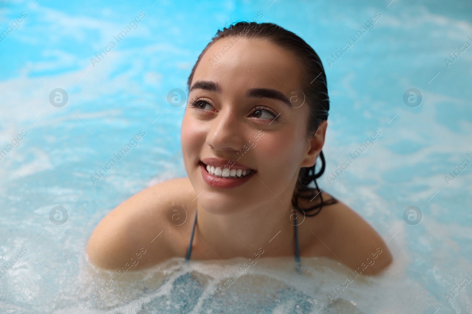 Photo of Beautiful woman relaxing in spa swimming pool