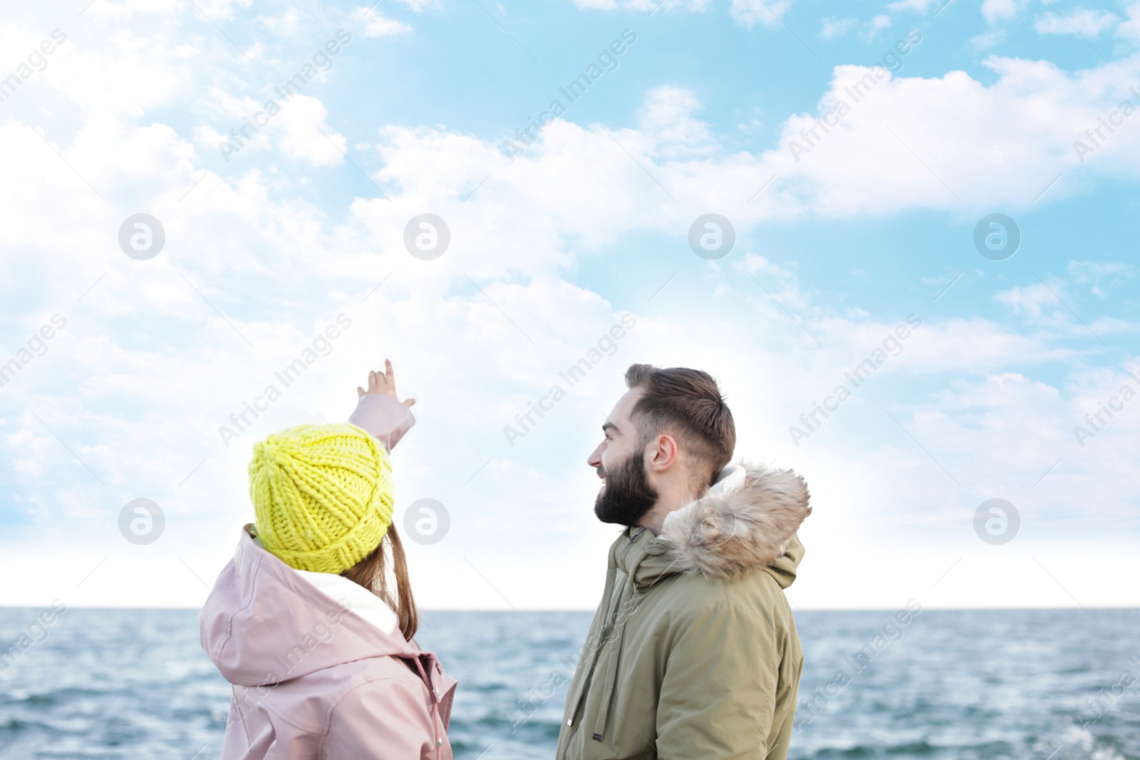 Photo of Lovely young couple spending time near sea