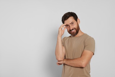 Portrait of handsome bearded man on white background