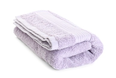 Photo of Folded violet terry towel isolated on white