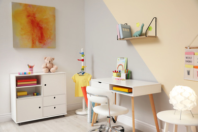 Photo of Stylish child room interior with modern furniture