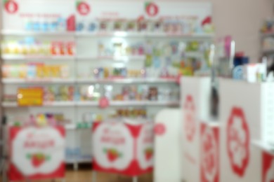 Photo of Blurred view of modern drugstore with pharmaceuticals
